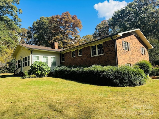 view of home's exterior featuring a lawn