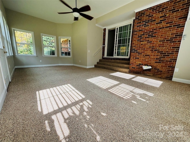 interior space with carpet flooring and ceiling fan