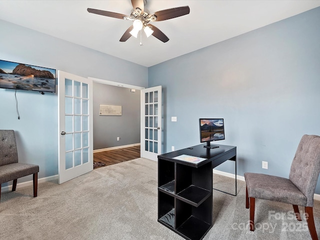 carpeted office with ceiling fan and french doors