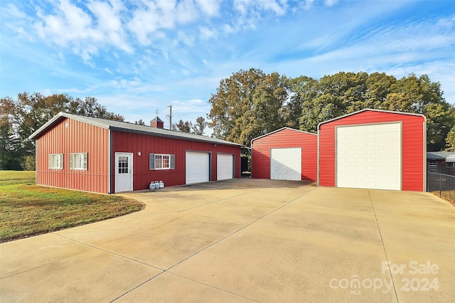 garage featuring a lawn