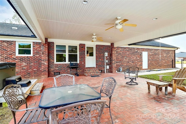 view of patio featuring ceiling fan