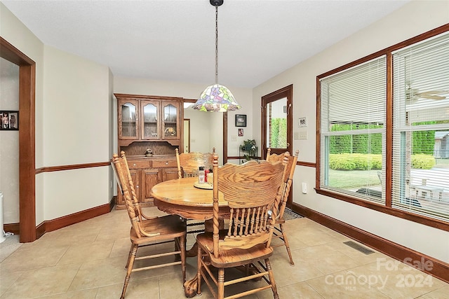 dining space with light tile patterned flooring