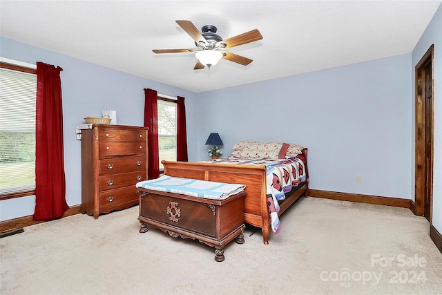 carpeted bedroom with ceiling fan