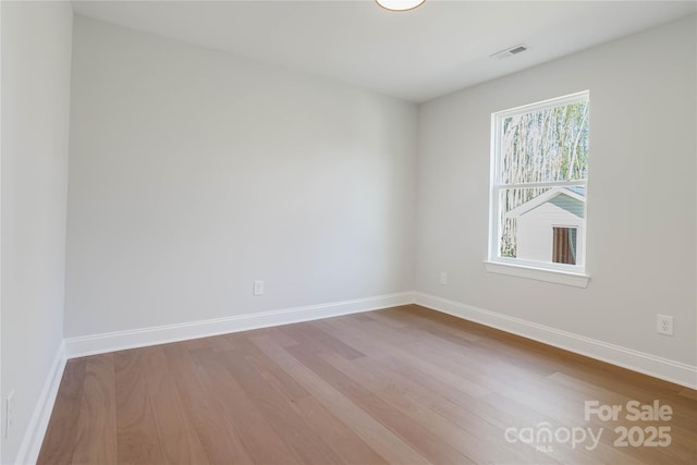 spare room featuring hardwood / wood-style flooring