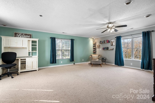 home office with ceiling fan, carpet, and a wealth of natural light