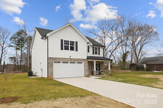 view of front facade featuring a garage, central AC, and a front yard