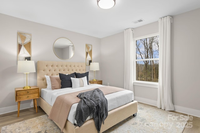 bedroom with light hardwood / wood-style flooring