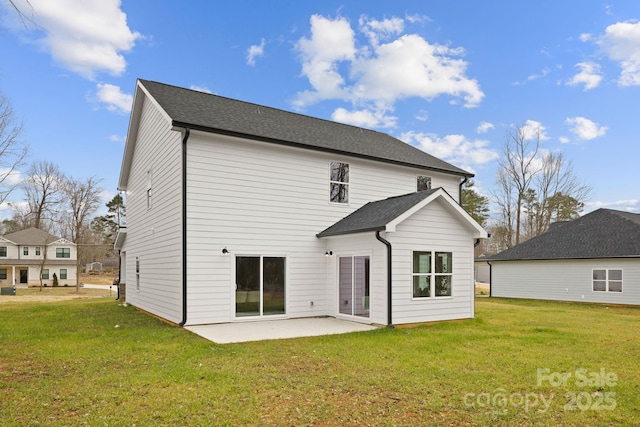 back of property with a patio area and a lawn