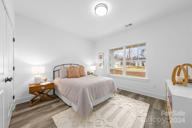 bedroom featuring dark wood-type flooring