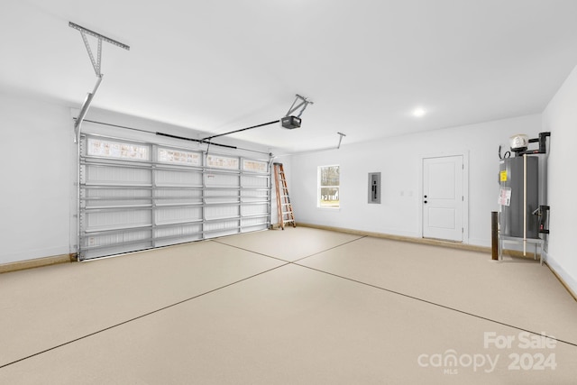 garage featuring electric water heater, electric panel, and a garage door opener