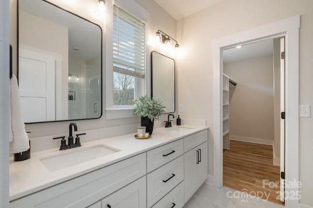 bathroom featuring hardwood / wood-style flooring and vanity