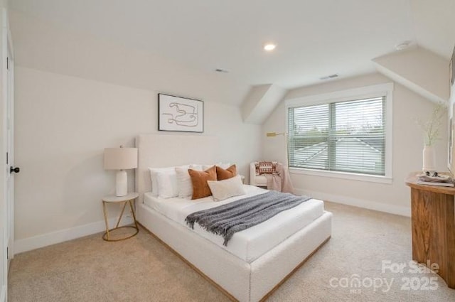 bedroom featuring carpet floors and vaulted ceiling