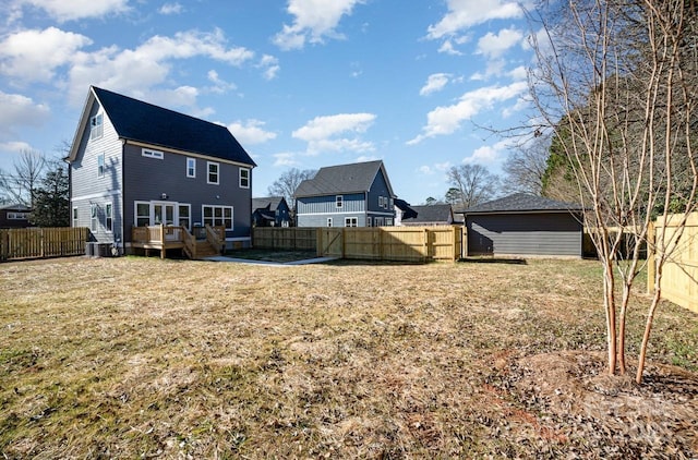 view of yard featuring a wooden deck and central air condition unit