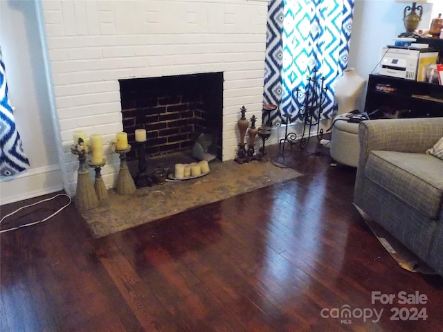 living room featuring hardwood / wood-style floors and a fireplace