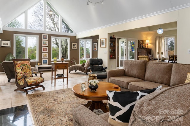 living room featuring crown molding, high vaulted ceiling, and light tile patterned floors