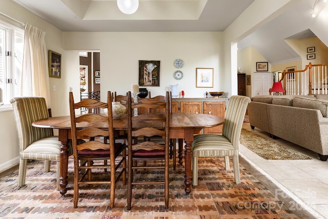 dining room with a tray ceiling