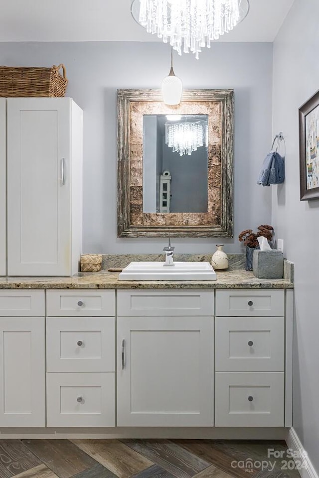 bathroom with vanity and hardwood / wood-style floors