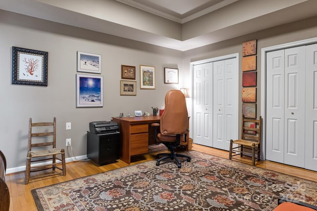 office featuring ornamental molding and hardwood / wood-style floors