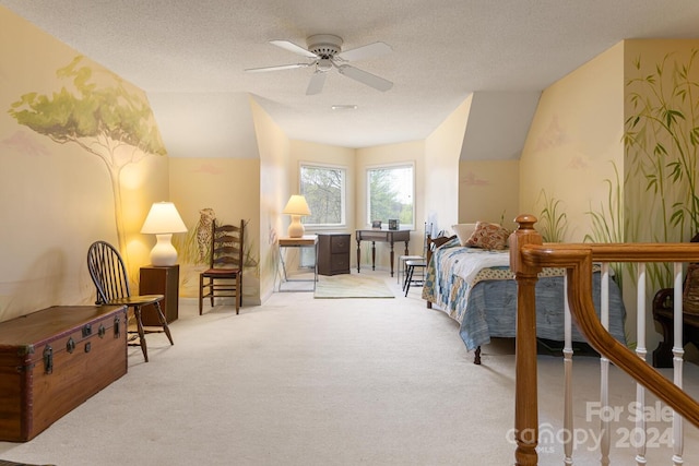 bedroom featuring lofted ceiling, light carpet, a textured ceiling, and ceiling fan