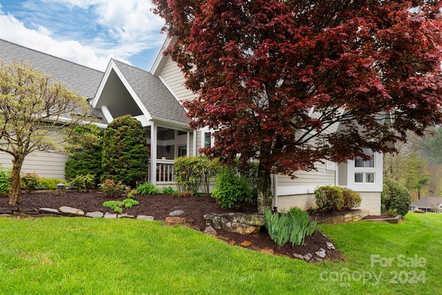 150 Overlook Dr, Flat Rock, NC 28731 - view of property exterior with roof with shingles, a lawn, and a sunroom