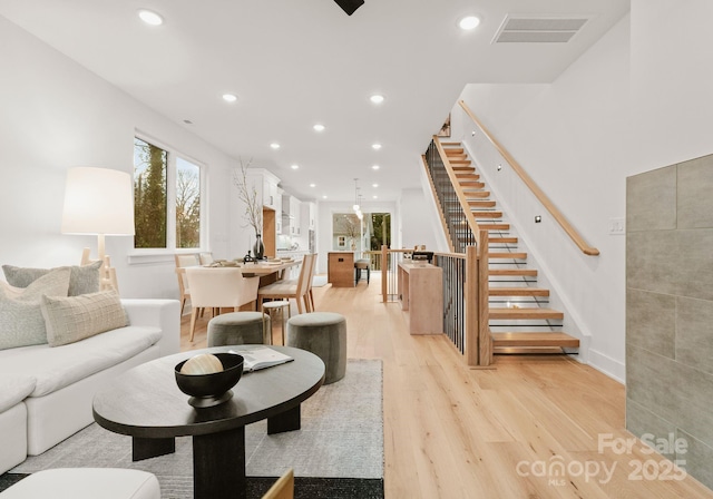 living room with light hardwood / wood-style floors