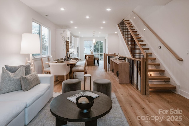 living room featuring a wealth of natural light and light wood-type flooring