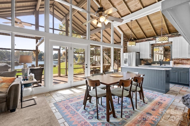 sunroom with wood ceiling, sink, vaulted ceiling with beams, and ceiling fan