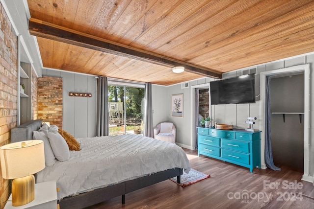 bedroom featuring wood walls, wooden ceiling, and dark wood-type flooring