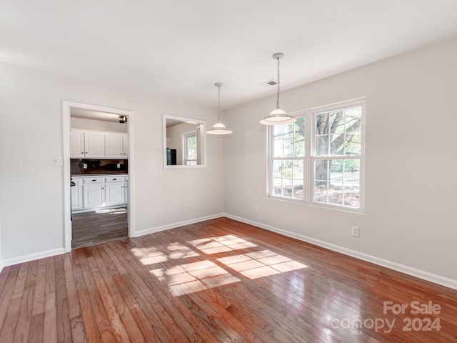 spare room featuring hardwood / wood-style flooring