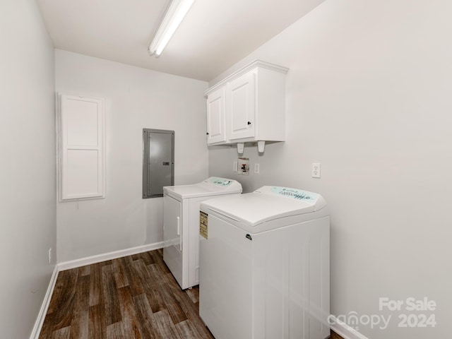 laundry area with electric panel, dark hardwood / wood-style floors, separate washer and dryer, and cabinets