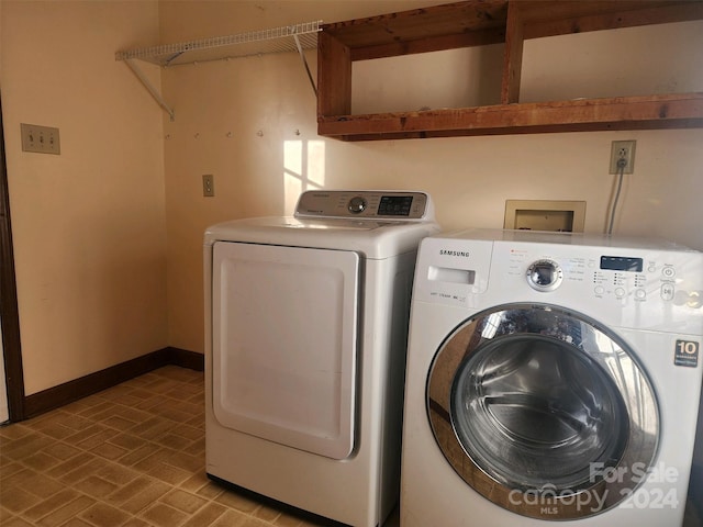 clothes washing area with washer and dryer