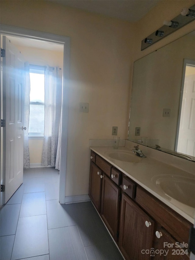 bathroom with vanity and tile patterned floors