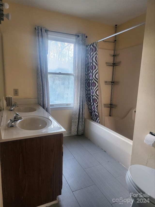 full bathroom with vanity, toilet, and shower / tub combo