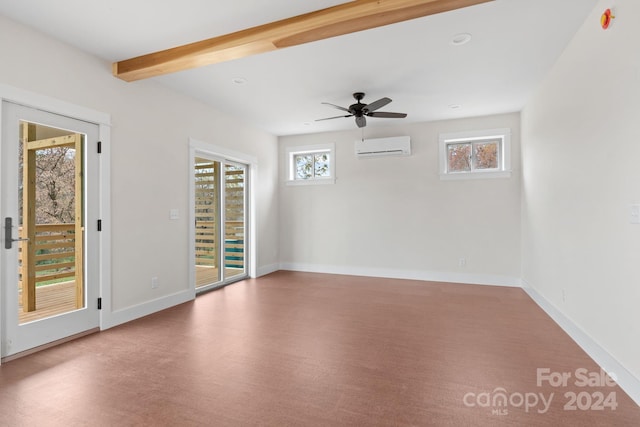 spare room with a wall mounted AC, beamed ceiling, a healthy amount of sunlight, and ceiling fan