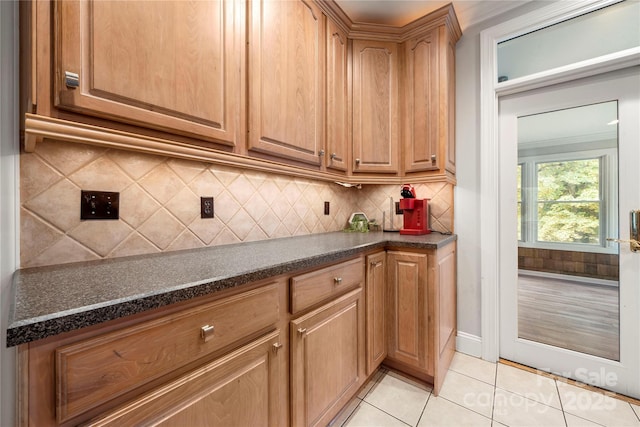 kitchen featuring tasteful backsplash and light tile patterned floors