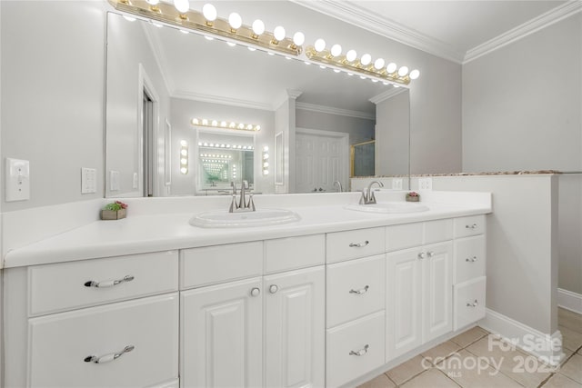 bathroom with crown molding, tile patterned floors, and vanity