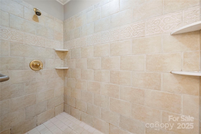 bathroom with a tile shower