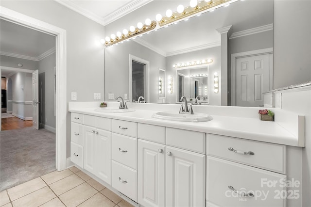 bathroom with vanity, crown molding, and tile patterned floors