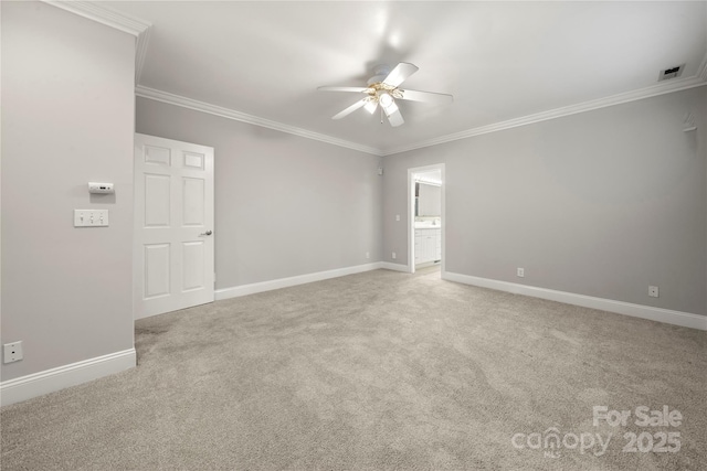 carpeted empty room with crown molding and ceiling fan