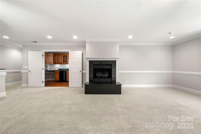 unfurnished living room with light carpet and crown molding