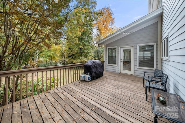 wooden deck with grilling area