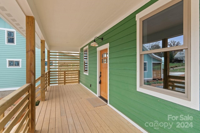 wooden terrace featuring a porch