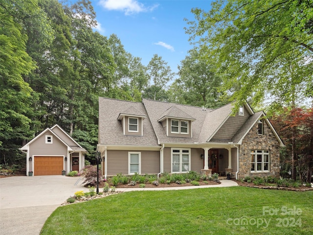 view of front facade with a front yard and a garage