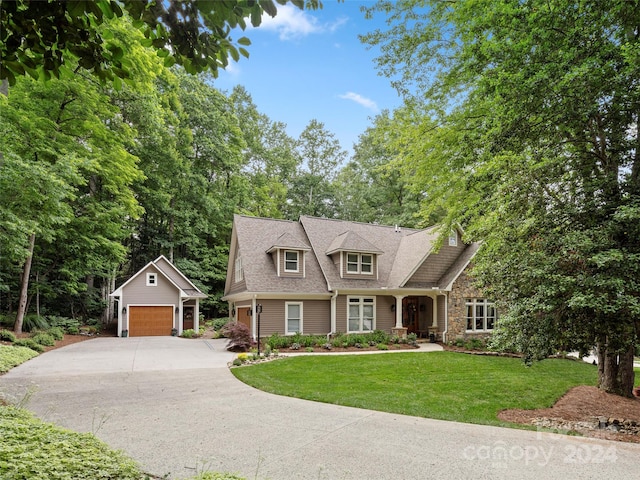 view of front facade featuring a front yard and a garage