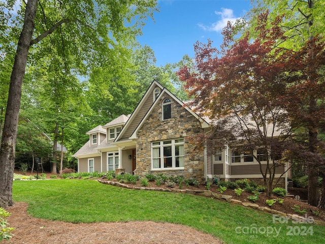 view of front of property with a front lawn