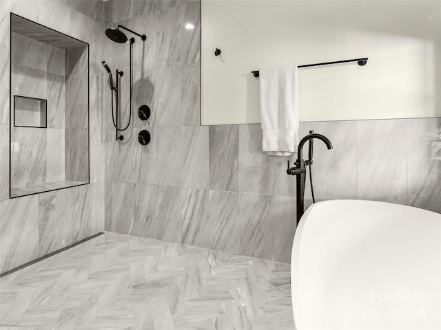 bathroom featuring tile walls and tiled shower