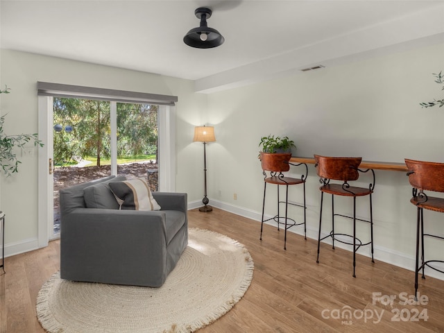 sitting room featuring light hardwood / wood-style floors