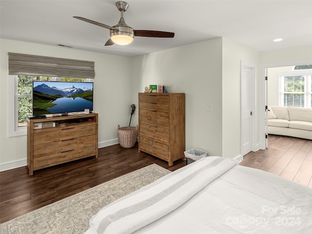 bedroom featuring dark hardwood / wood-style floors and ceiling fan