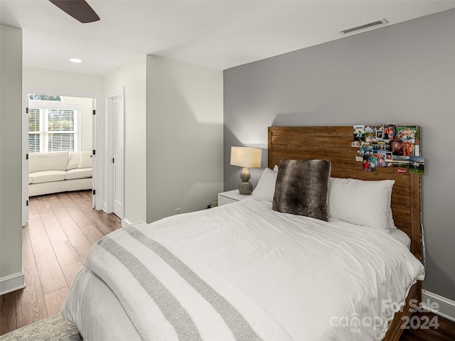 bedroom featuring hardwood / wood-style flooring and ceiling fan