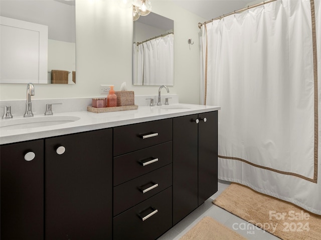 bathroom with vanity and tile patterned floors